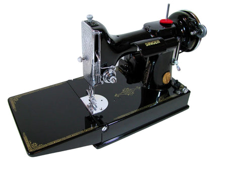 Vintage Singer sewing machine model 221 featherweight with unique metal parts and logo detail, close-up view.